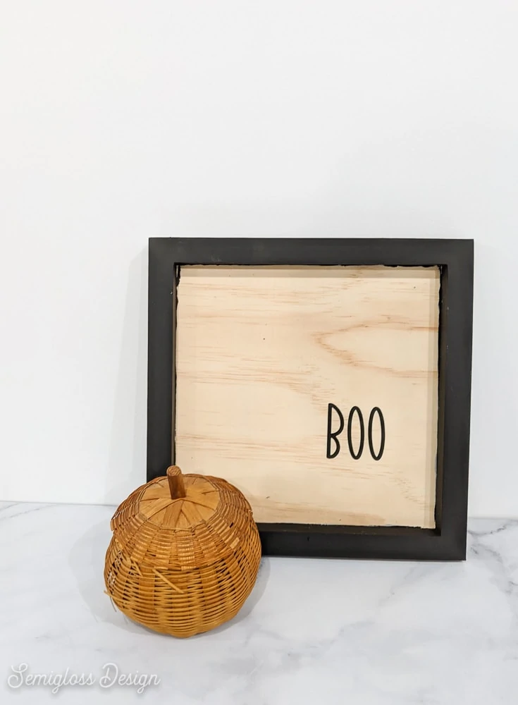 wooden sign with Boo written on it