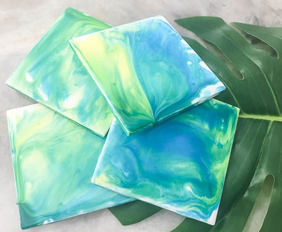 paint pour coasters on tropical leaf