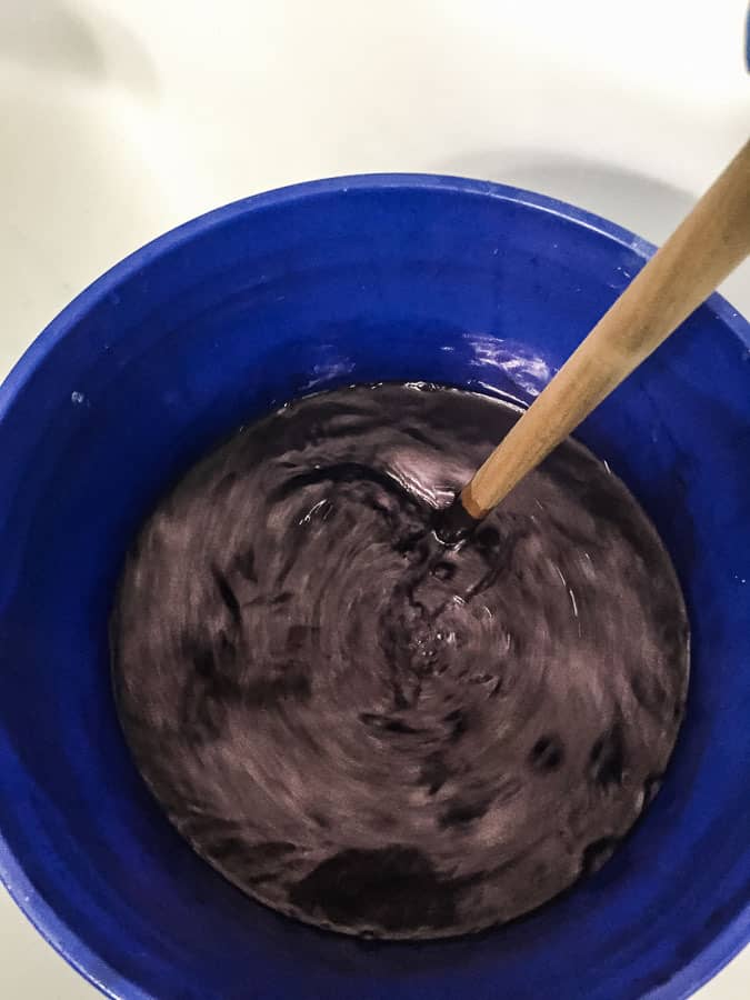 stirring in shibori dye