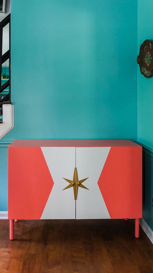 coral ikea besta against turquoise wall