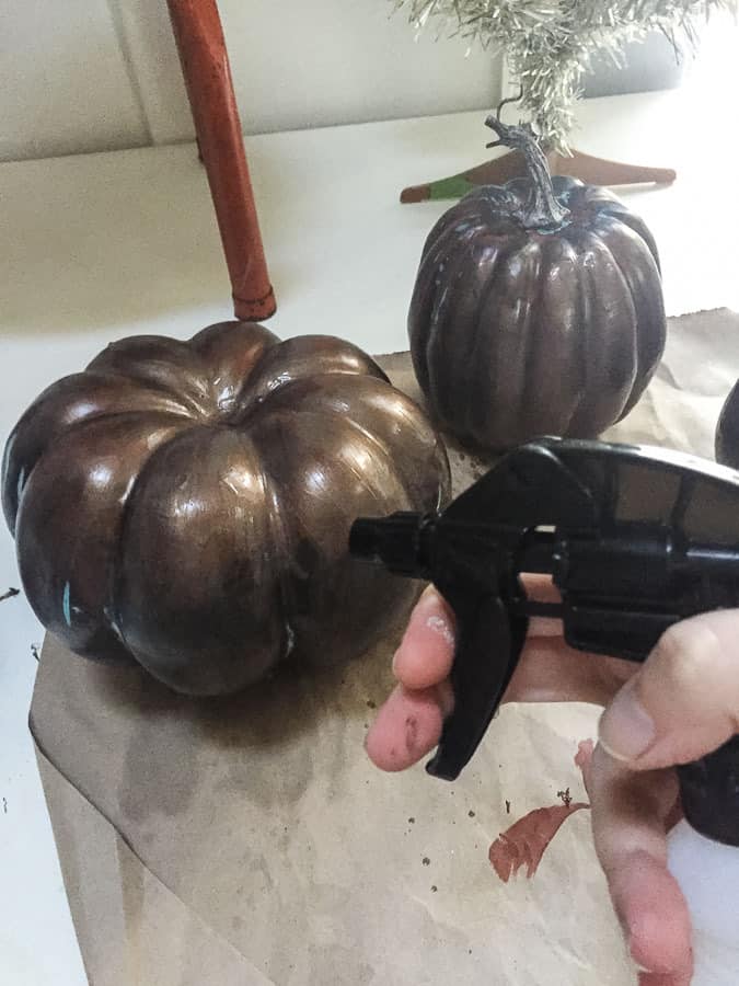 spraying pumpkins with patina