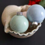 pastel ornaments in seashell bowl