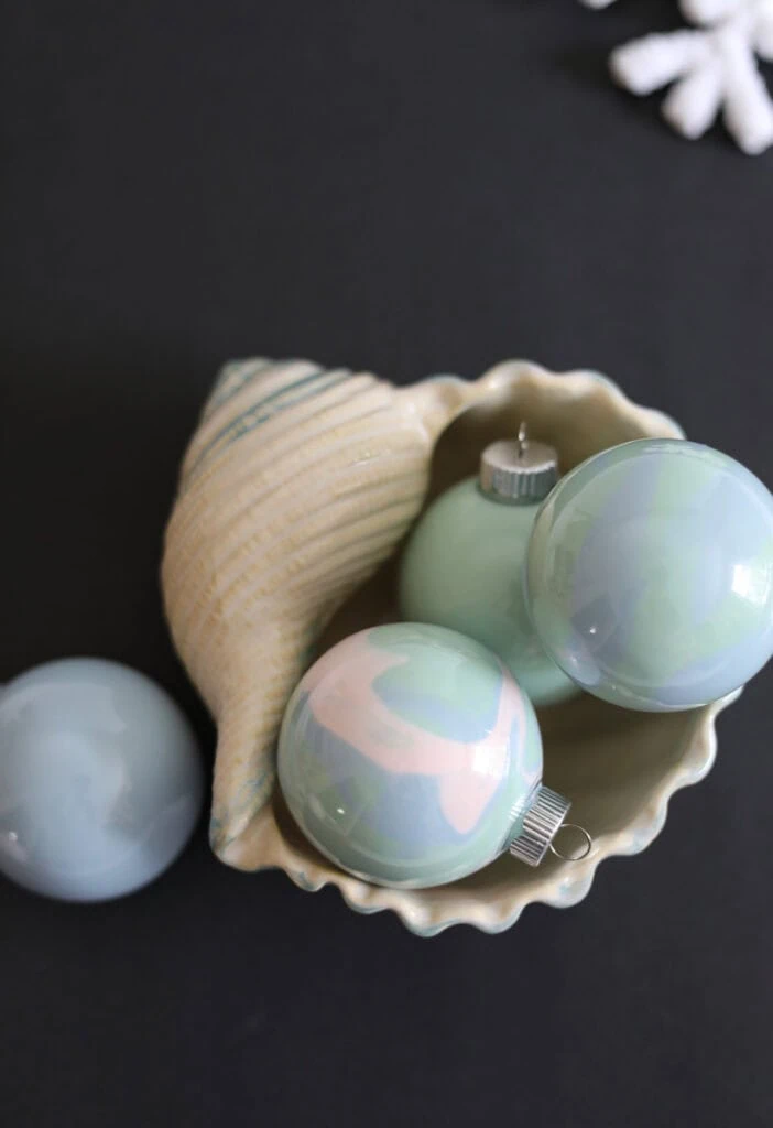 pastel ornaments in shell bowl