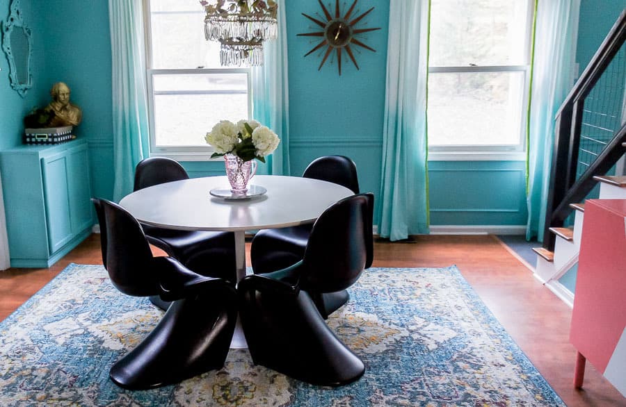 dining room with teal walls