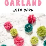 pom pom garland on marble background