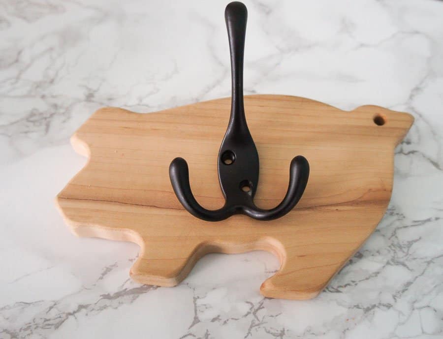 place hook on front of pig cutting board