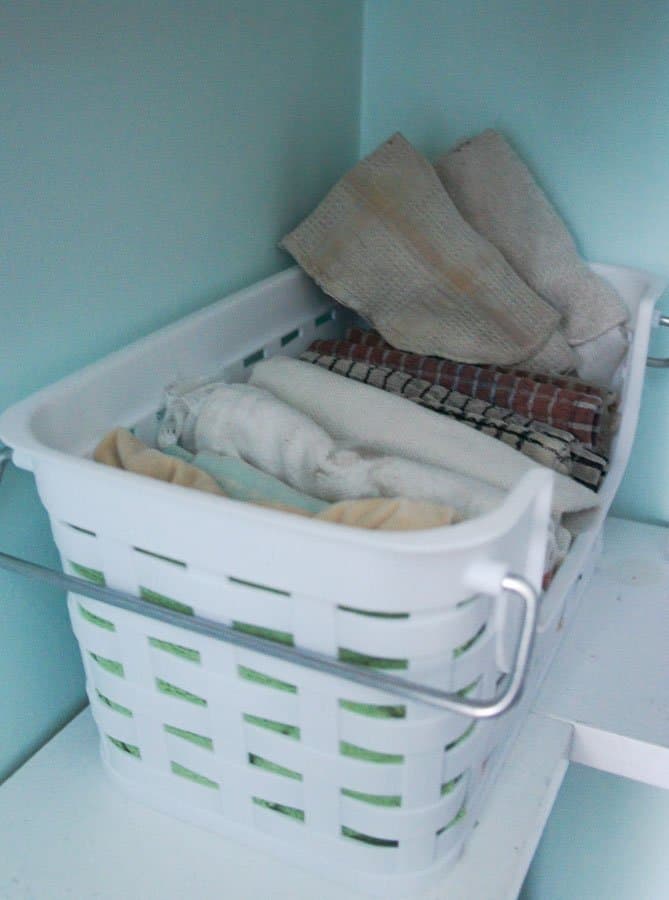 plastic basket with cleaning rags