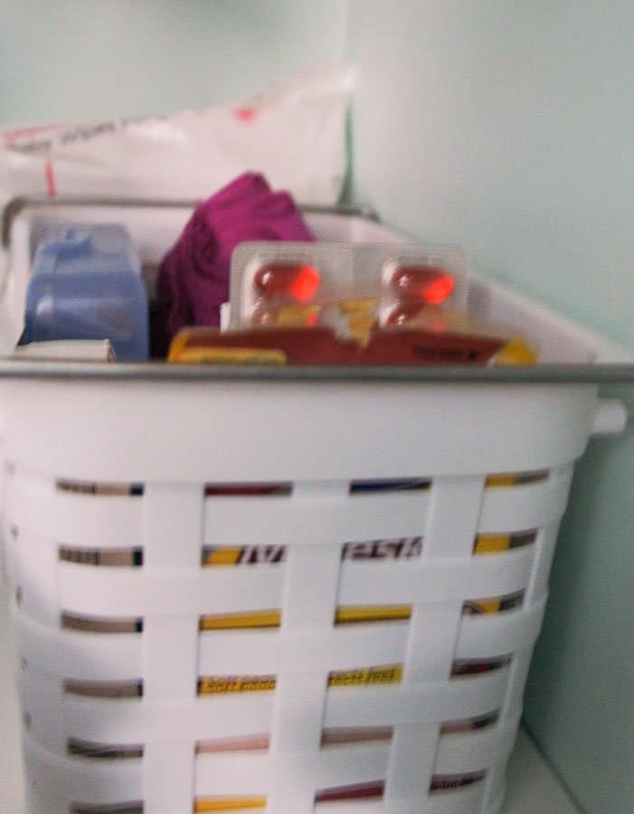 medicine basket in linen closet