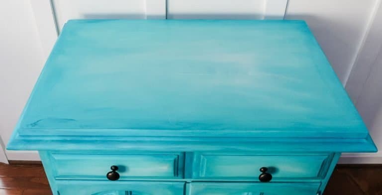 layered chalk paint on aqua buffet cabinet