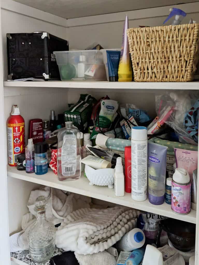 messy bathroom closet before