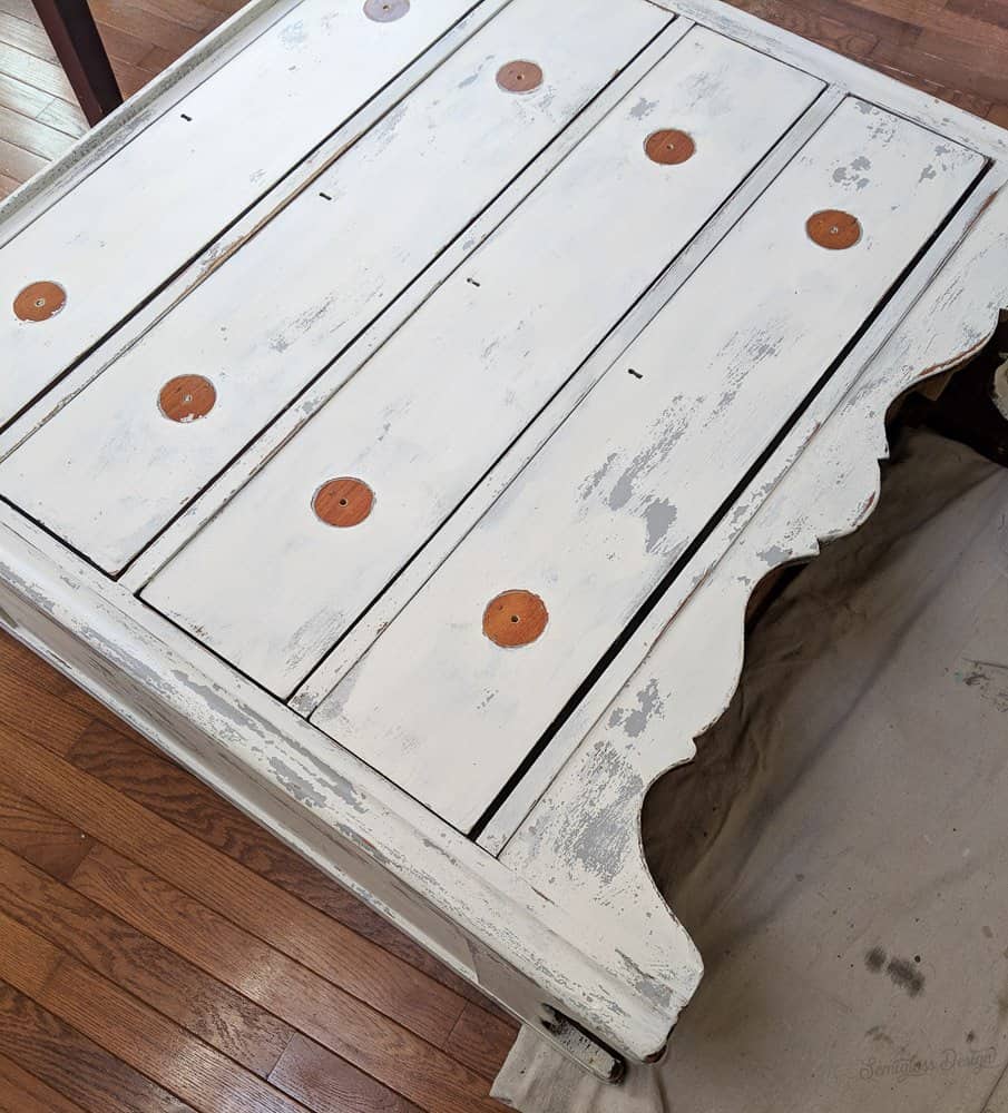 milk painted dresser laying on back