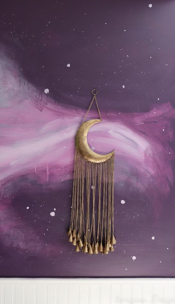 moon chimes on galaxy wall in boho bedroom