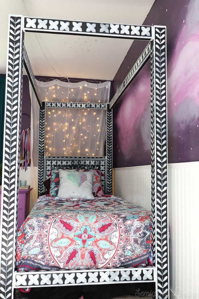 boho bedroom with twinkle lights and bone inlay canopy bed