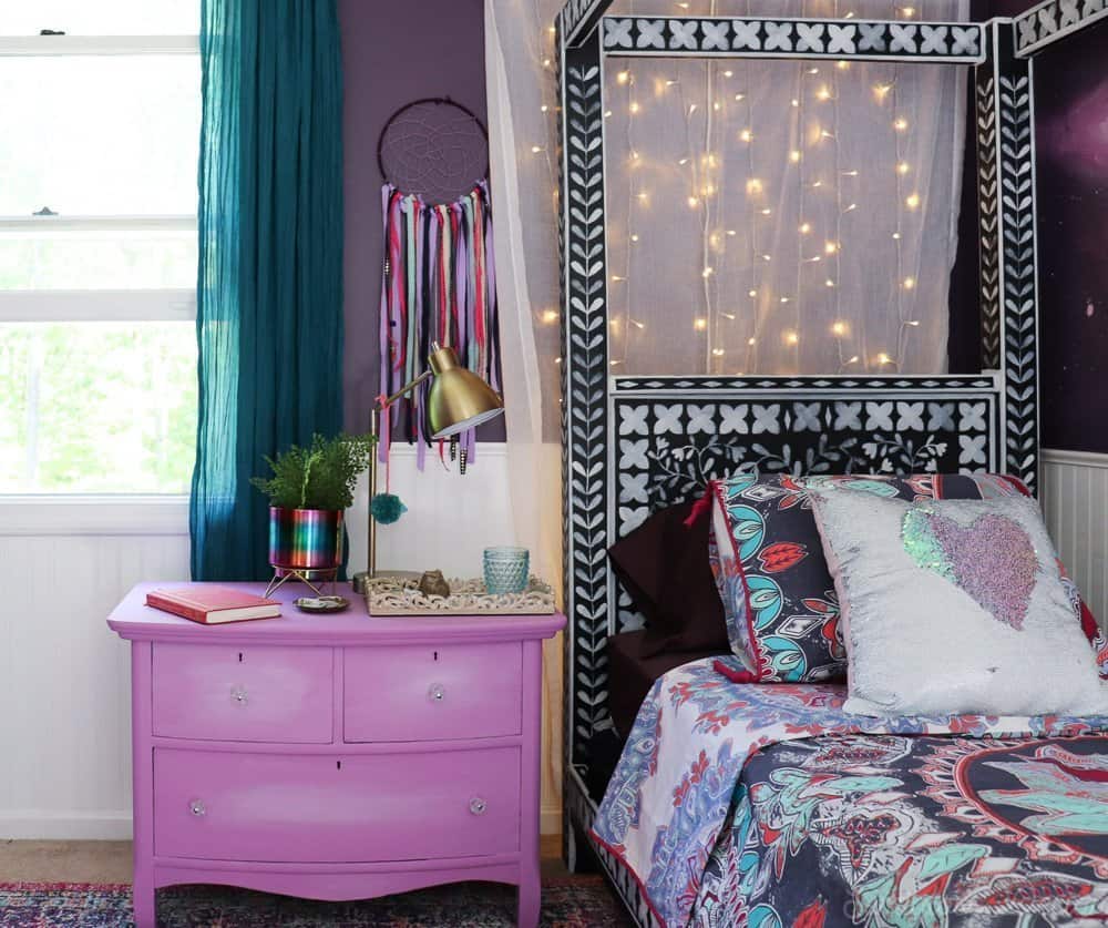 purple bohemian bedroom with twinkle lights