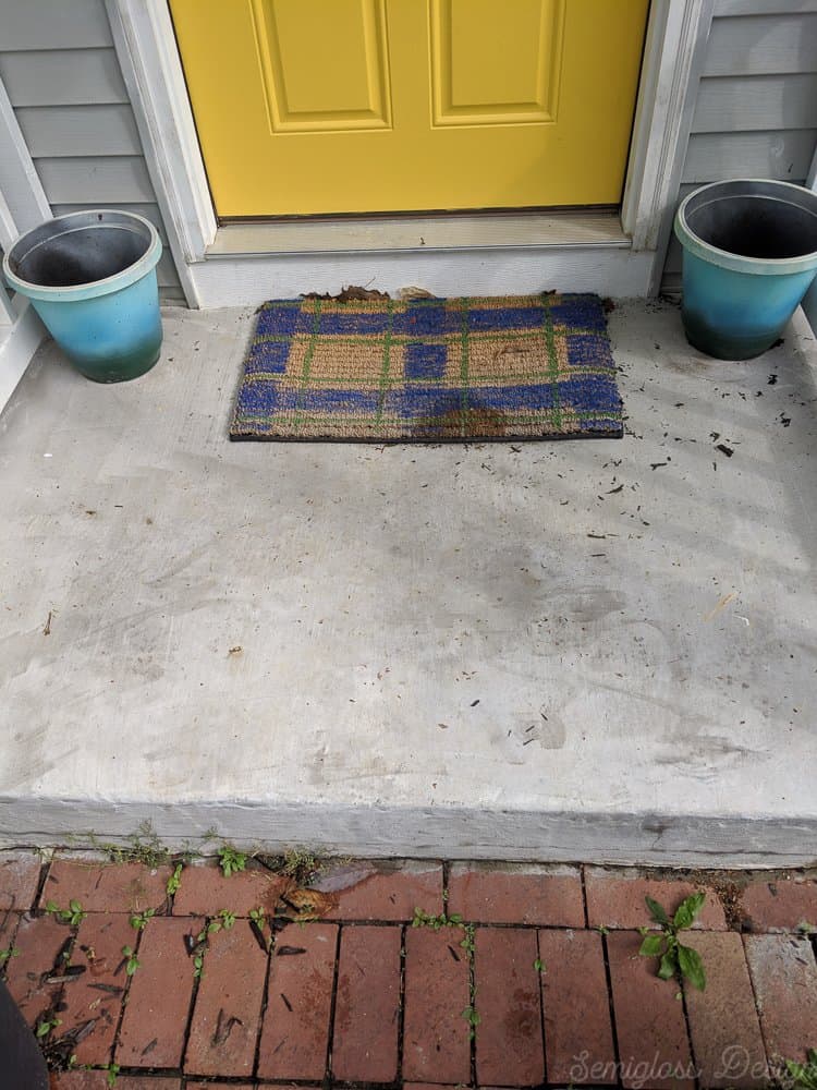 old doormat before porch makeover