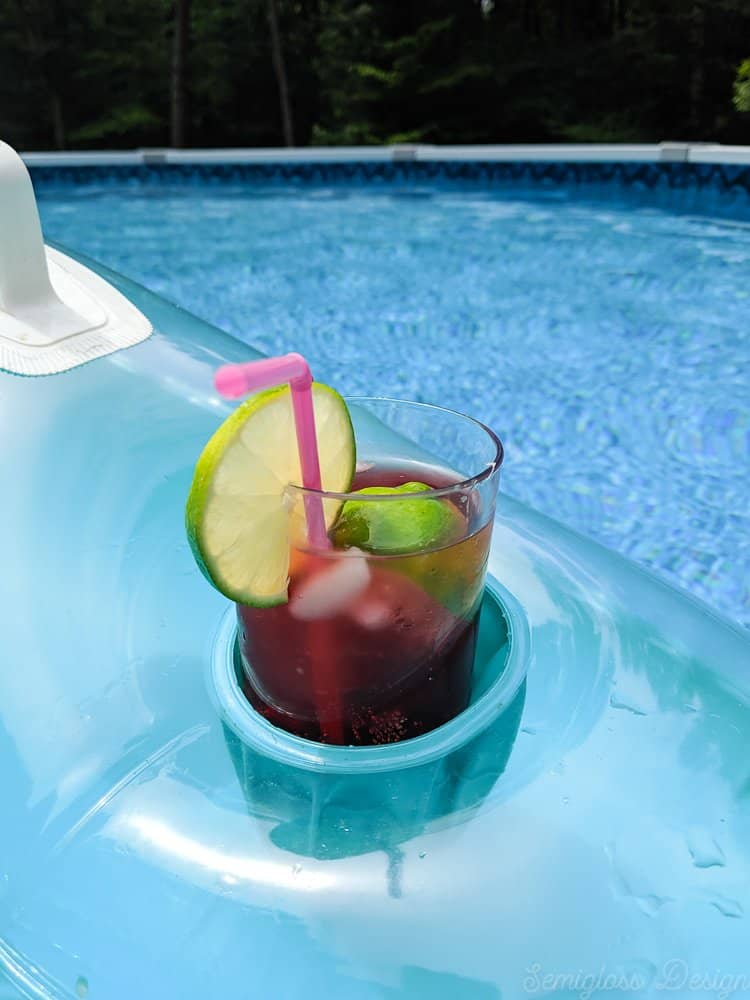 cherry limeade cocktail in pool float