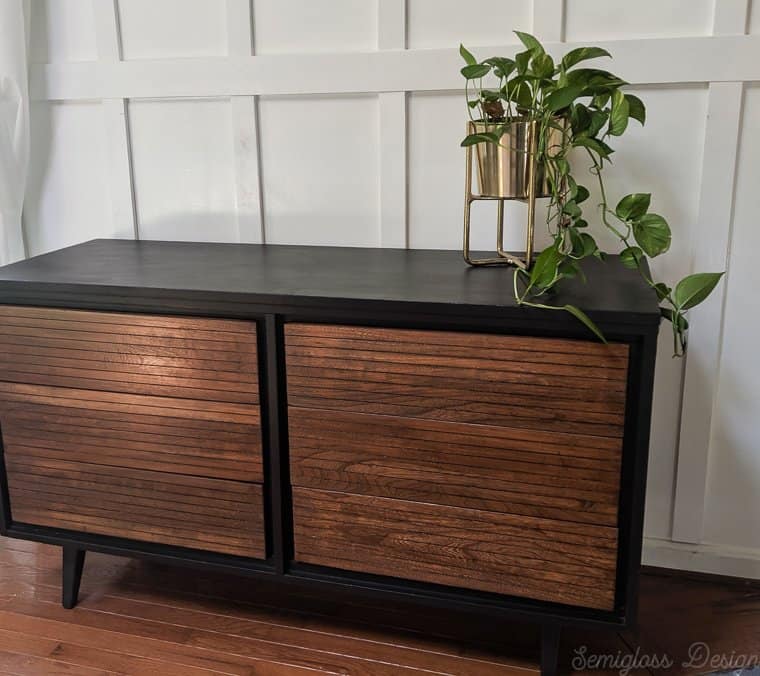 refinished midcentury dresser after stripping paint from drawers