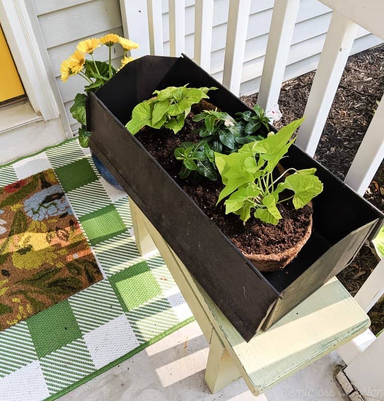 upcycled toolbox to flower planter on vintage bench for porch makeover.