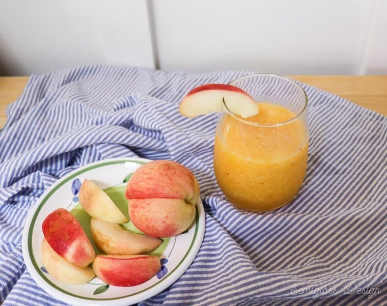 plate of peaches and frozen bellini drink