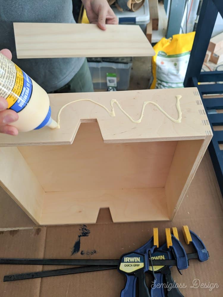 use wood glue to attach wood fronts to drawers