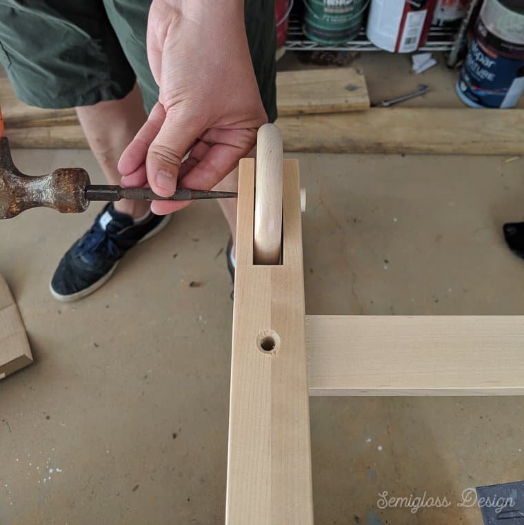 using nail setter to knock out dowel