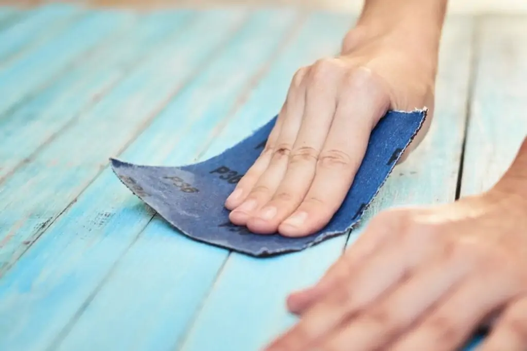 sanding blue painted wood