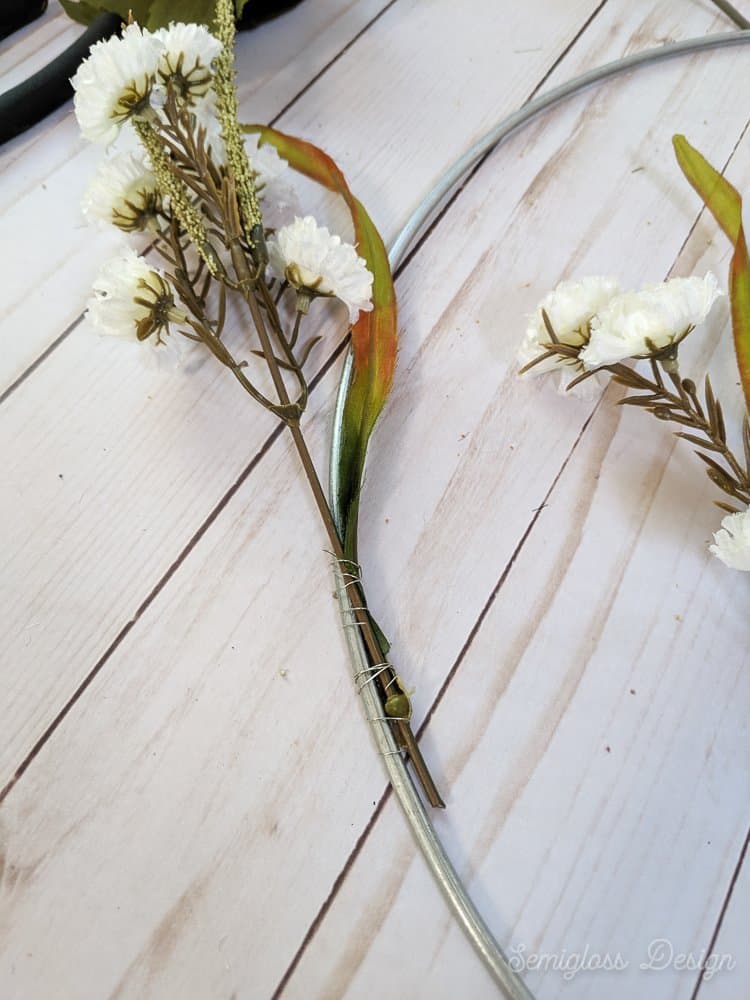 using wire to attach flowers to wreath ring