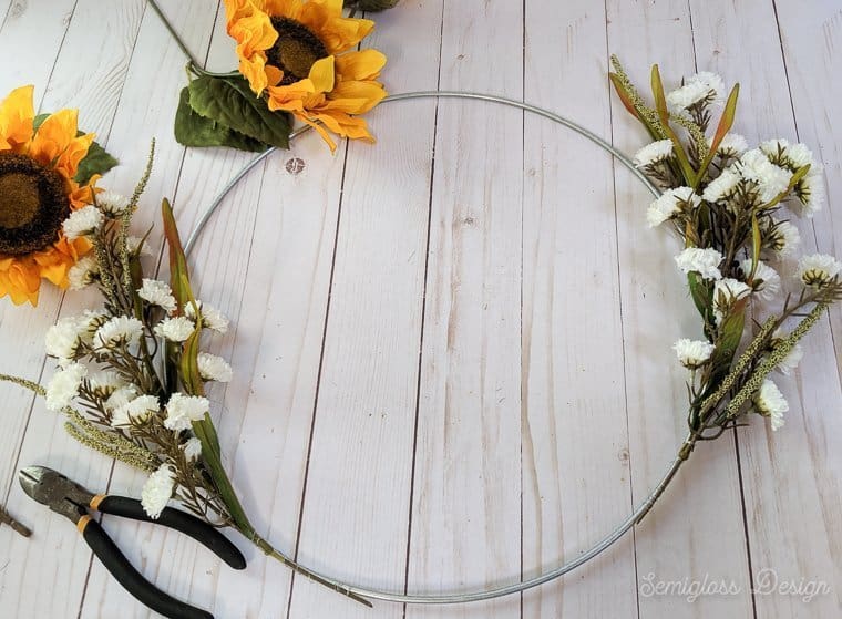 attaching flowers to wreath form with wire