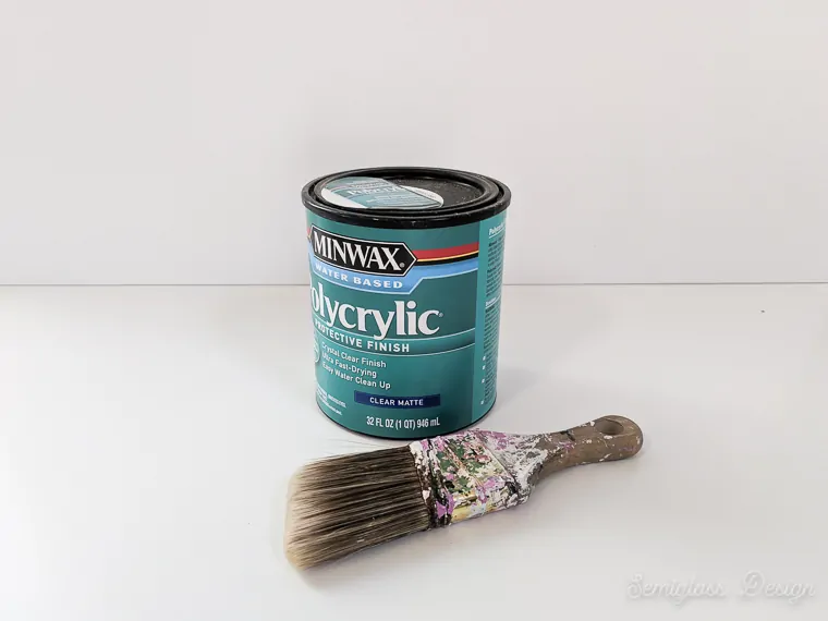 can of polycrylic and paint brush