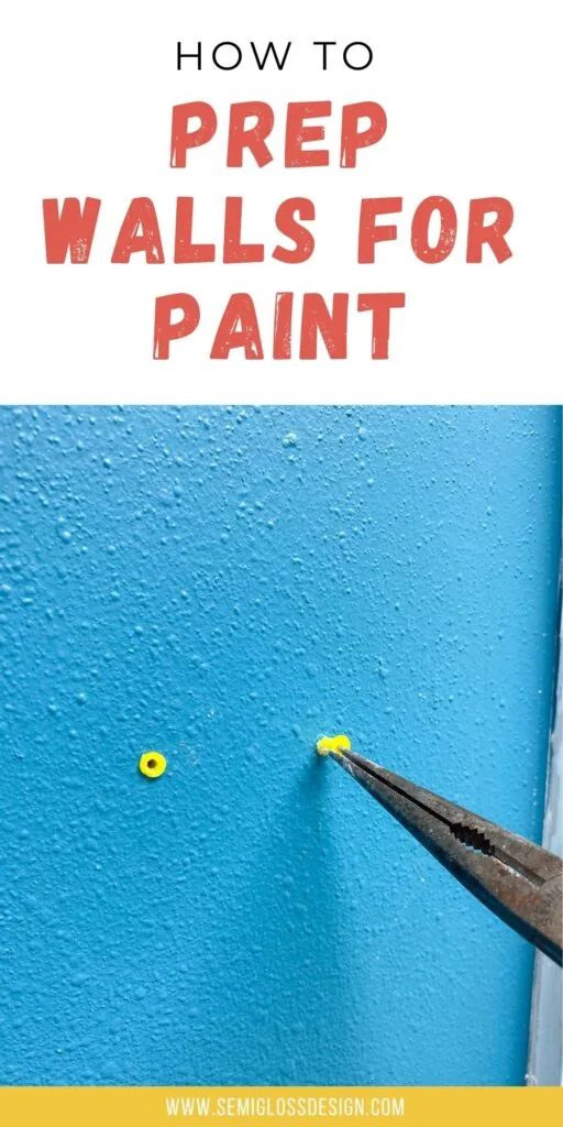 pliers pulling out wall anchor on blue wall