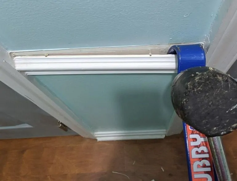 removing chair rail with pry bar