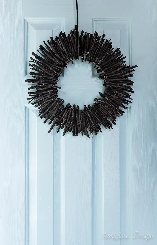 modern, rustic twig wreath on aqua door