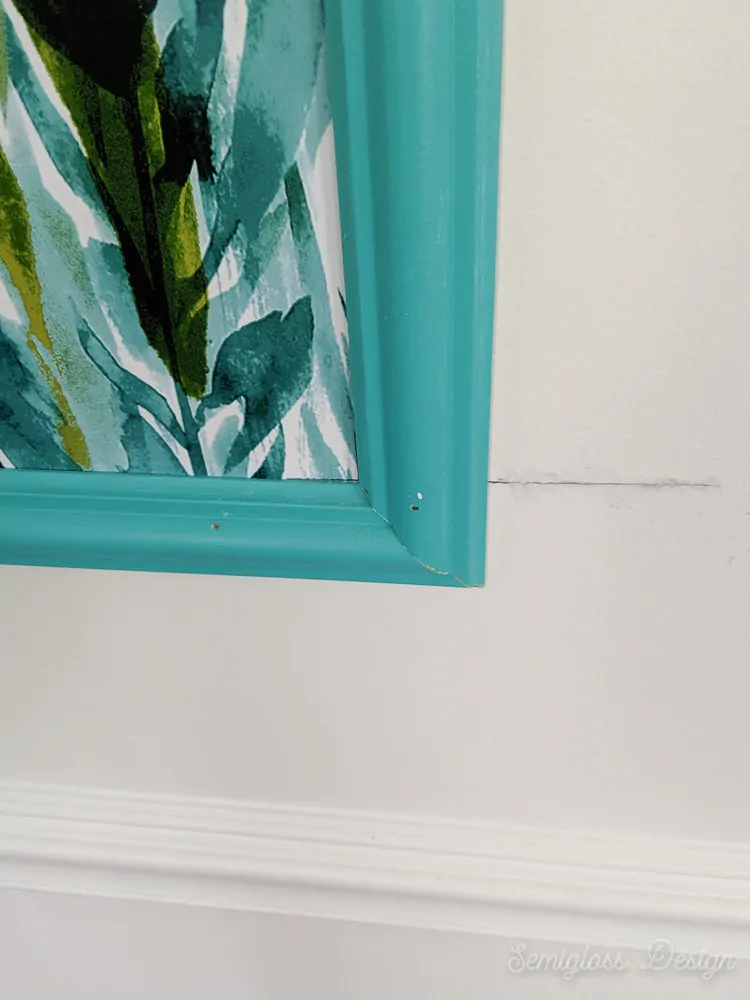 nail holes and cracks at corner of frame to be filled