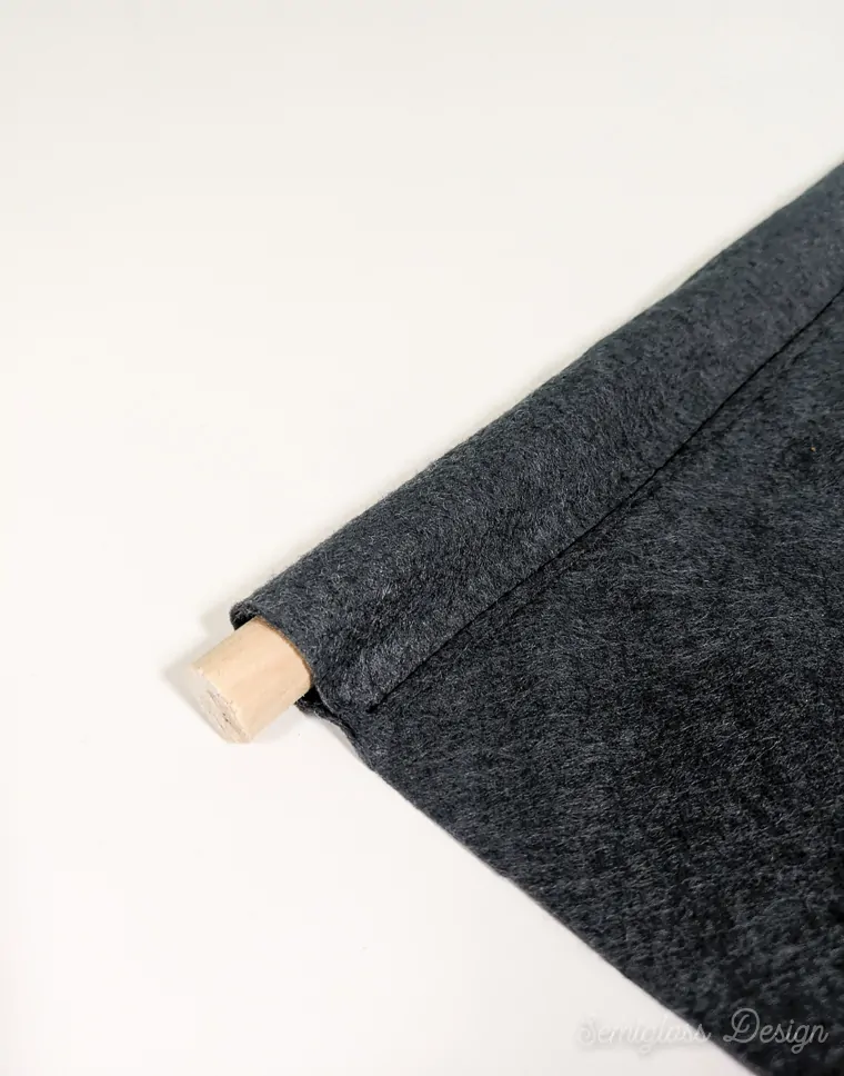 dowel in pocket on felt banner