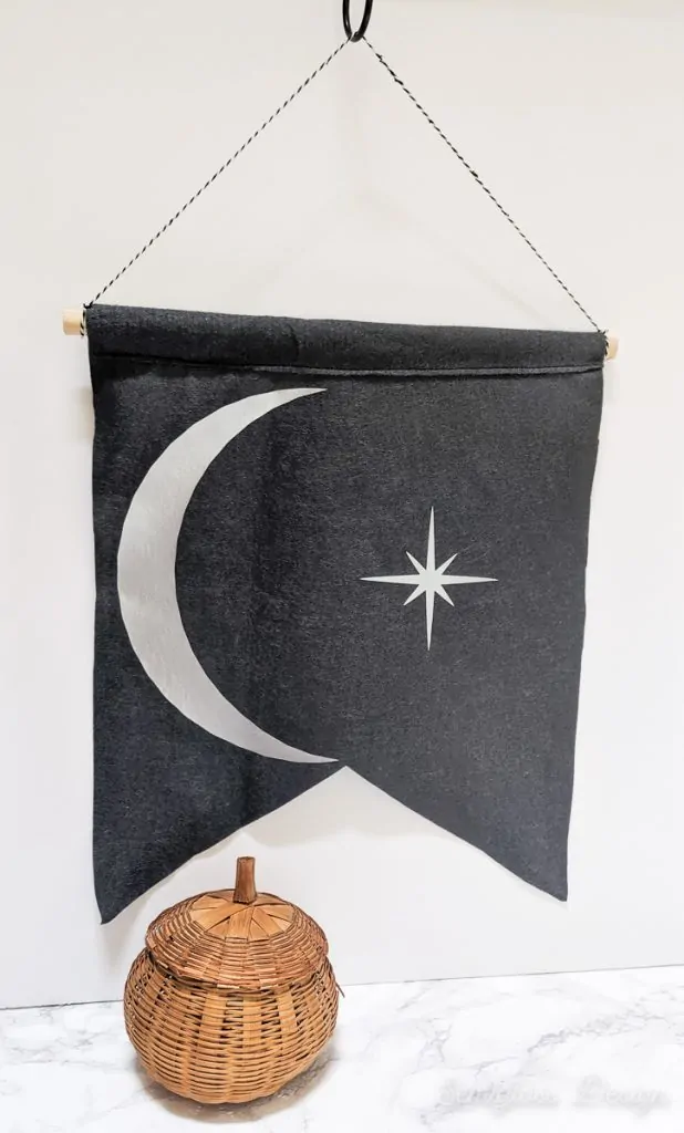 moon and star banner with wicker pumpkin