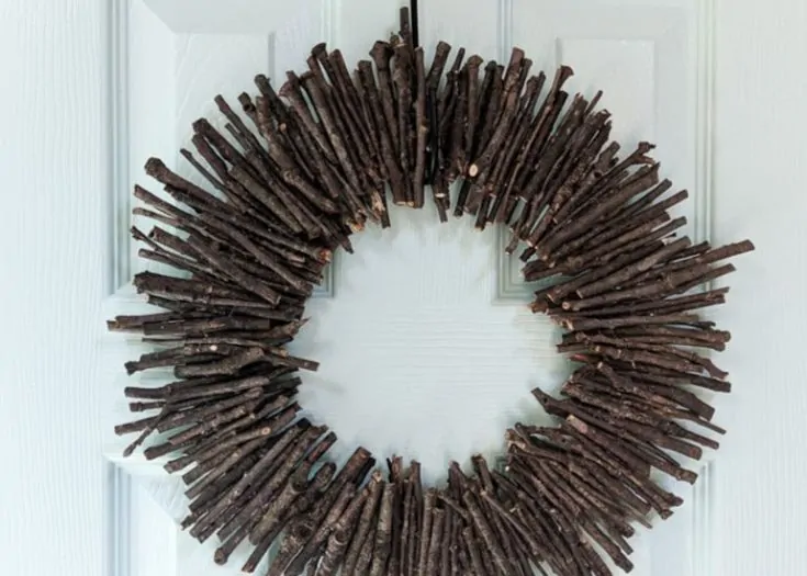 modern twig wreath on aqua door