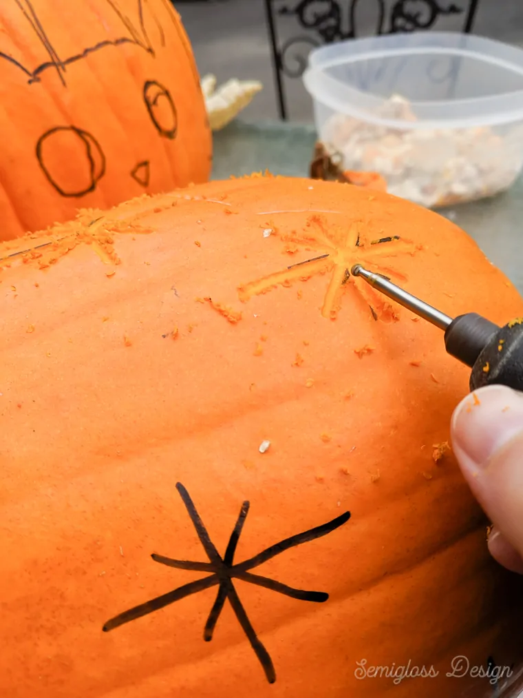 using a dremel to etch pumpkins with retro starburst design