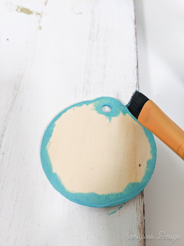 painting edges of wood ornament blue