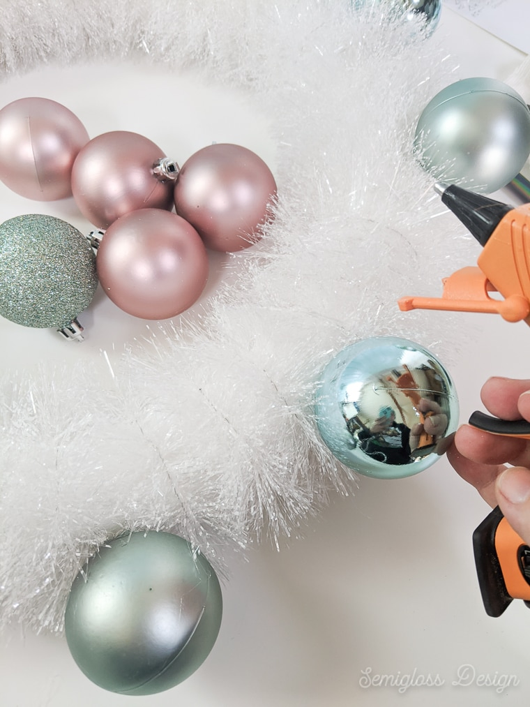 gluing ornaments to wreath