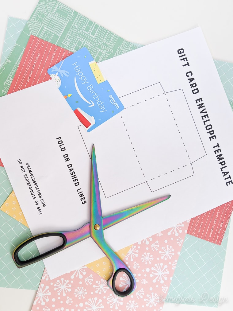 paper and scissors for making a gift card envelope