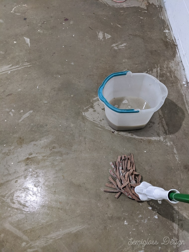 mopping a dirty concrete floor 