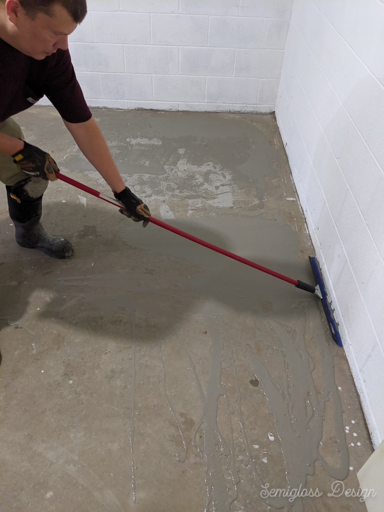 using a squeegee to smooth concrete