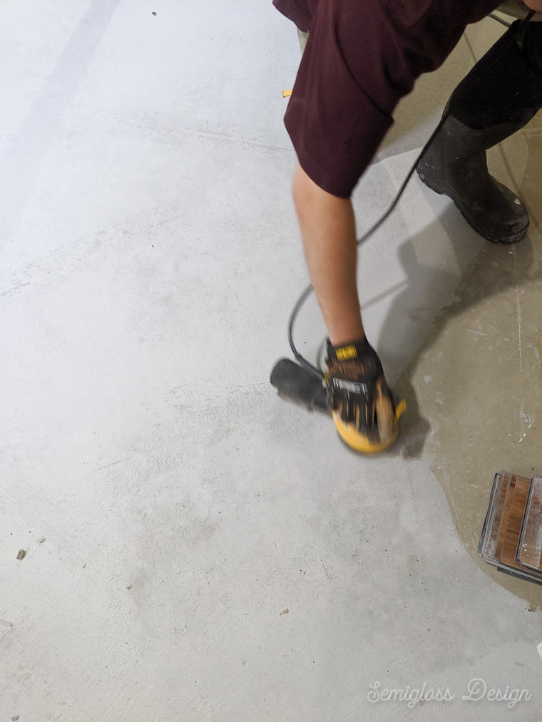 sanding the concrete overlay between coats