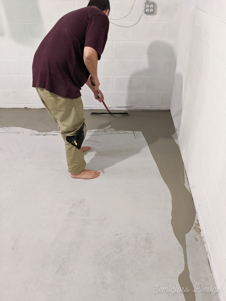 spreading concrete with a squeegee