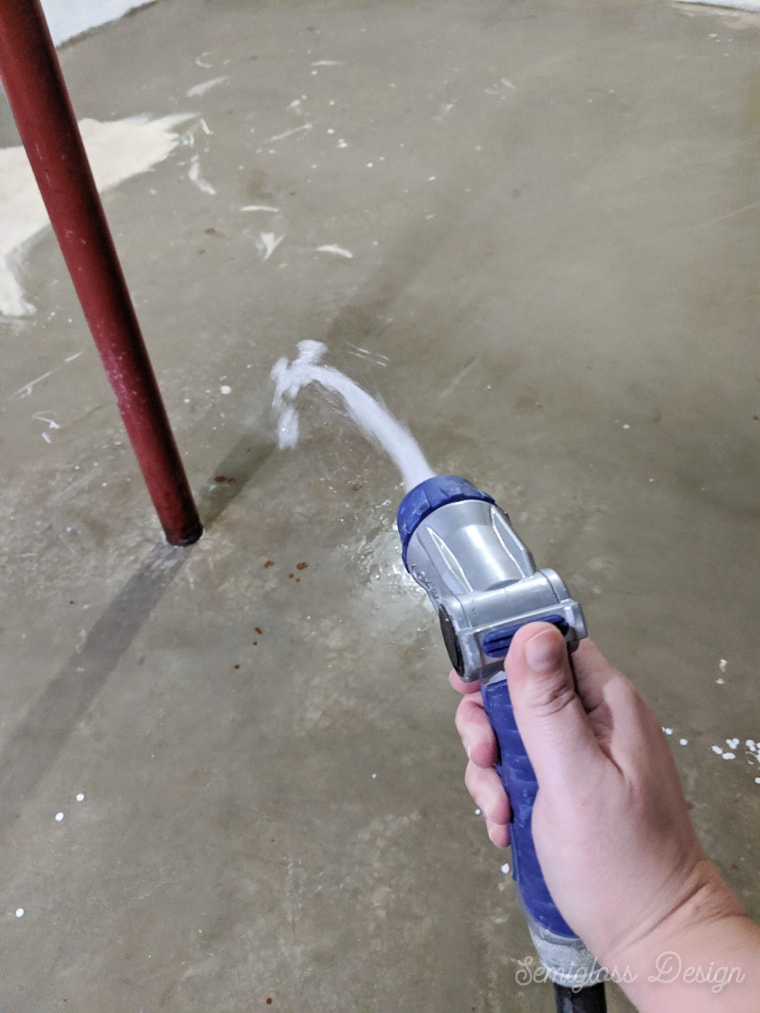 spray concrete floor with water