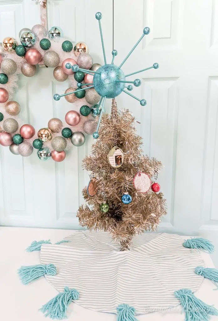 atomic tree topper on mini tinsel tree