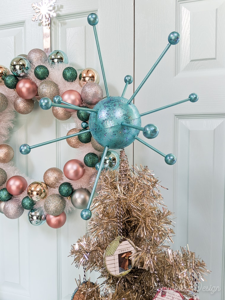 atomic tree topper on vintage tinsel christmas tree