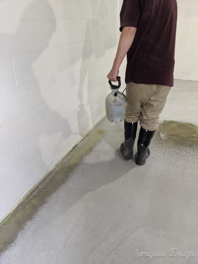 spraying edges of concrete with acid stain