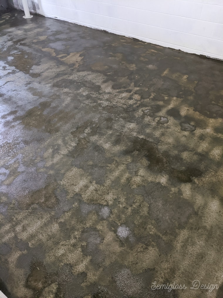 concrete stain starting to dry on basement floor