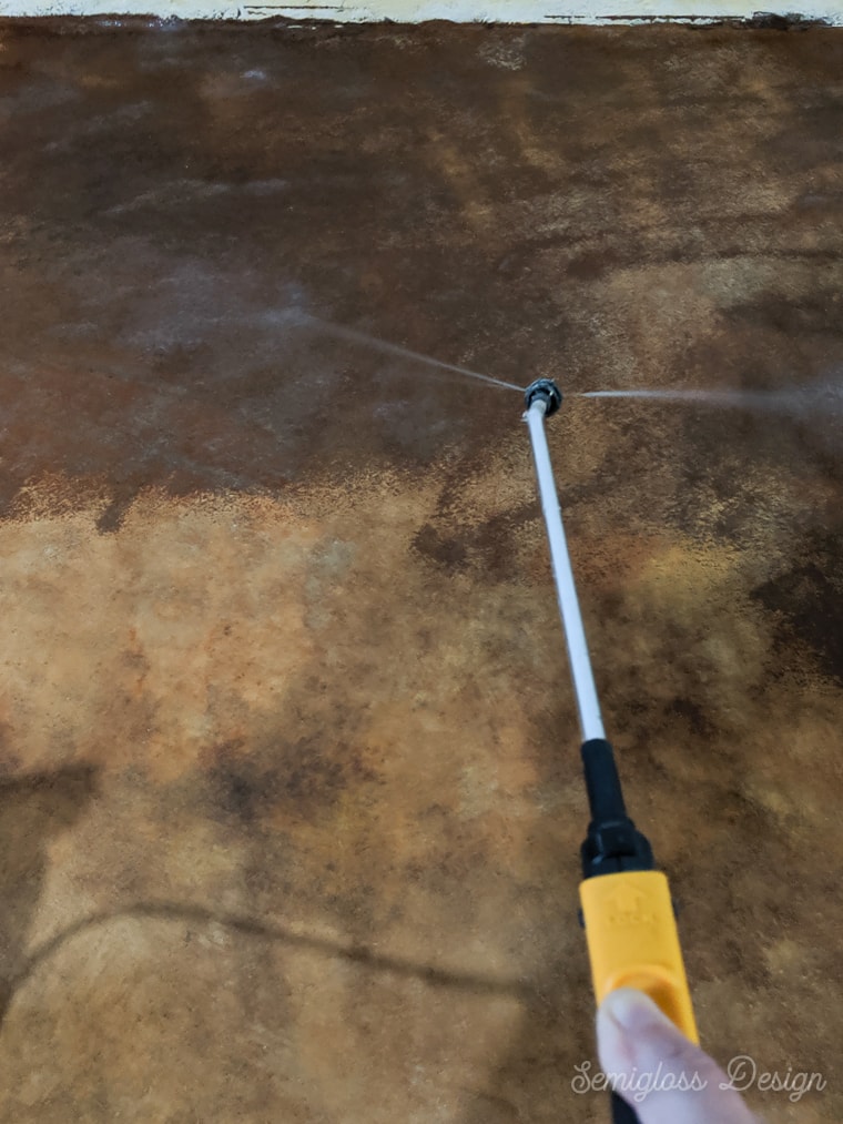 spraying stain with water and neutraclean
